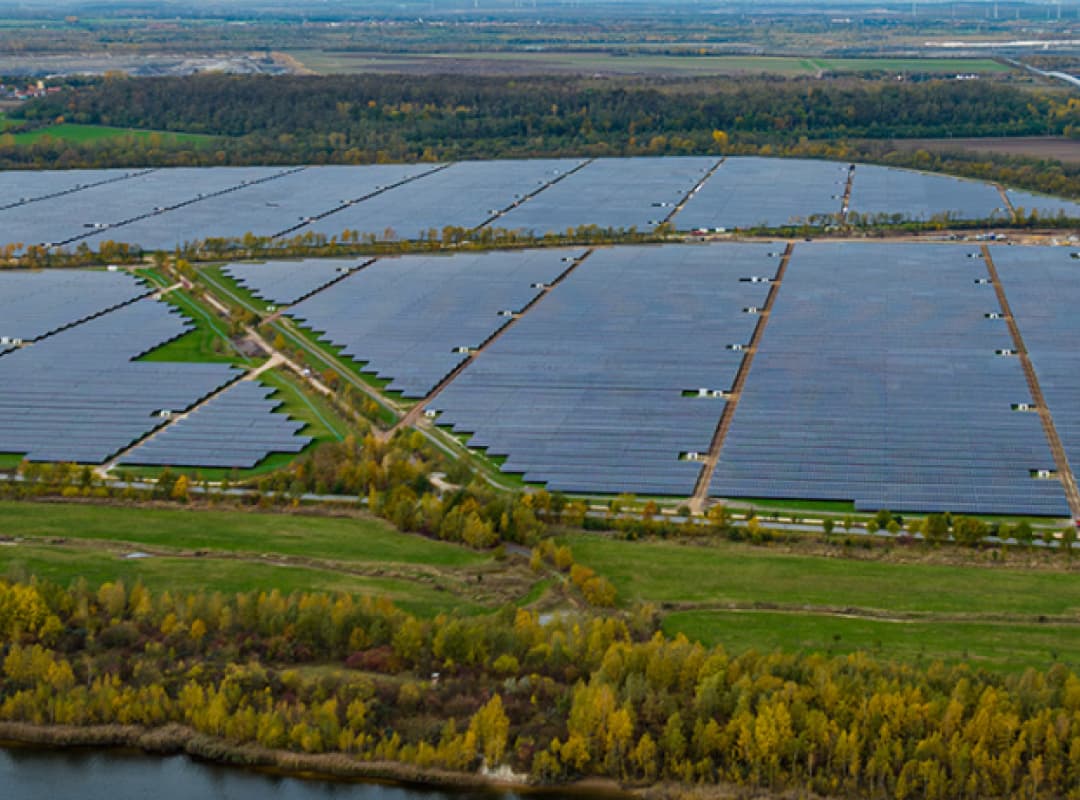 A panoramic view of a huge solar farm with PV modules collecting the suns energy